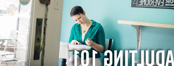 women filling out an application at a desk